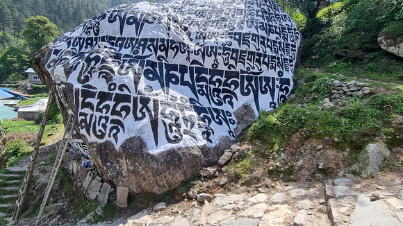 Repairing the Mani stone, near Ghat
