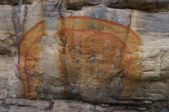 At Ubirr.  Created by Garranga'rreli, as a reminder of her visit as the Rainbow Serpent.